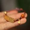 2023 Zodiac Year bracelet: Forbidden City color amber bracelet for boys and girls, a niche design of traditional Chinese style jewelry Specification image